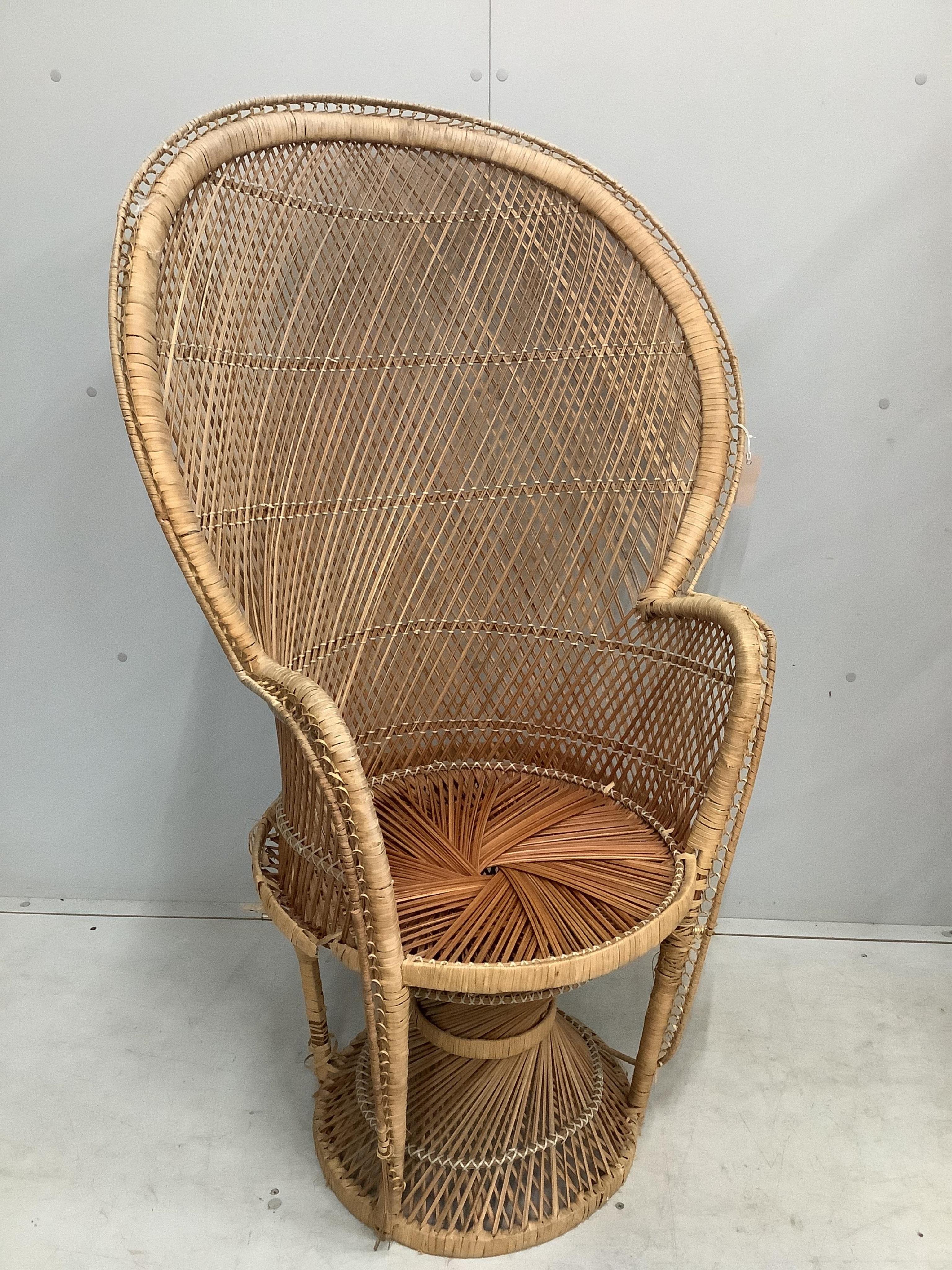 A rattan elbow chair, width 82cm, height 130cm together with a three fold screen